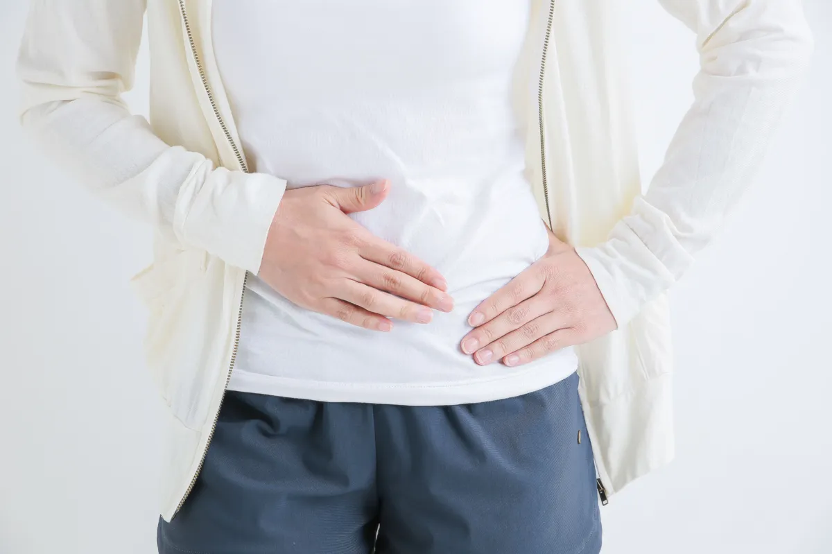 Patient experiencing slight pain and tenderness during recovery after hernia repair surgery