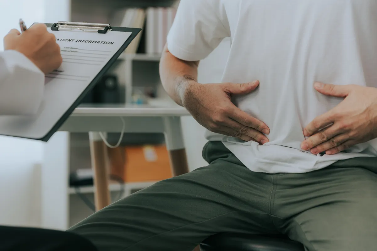 Doctor advising a patient about recovery after hernia repair surgery